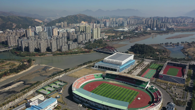 航拍城市密集建筑车流体育馆